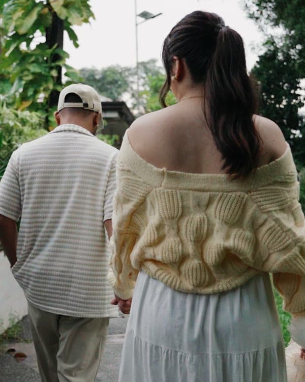 Walking hand in hand through the garden