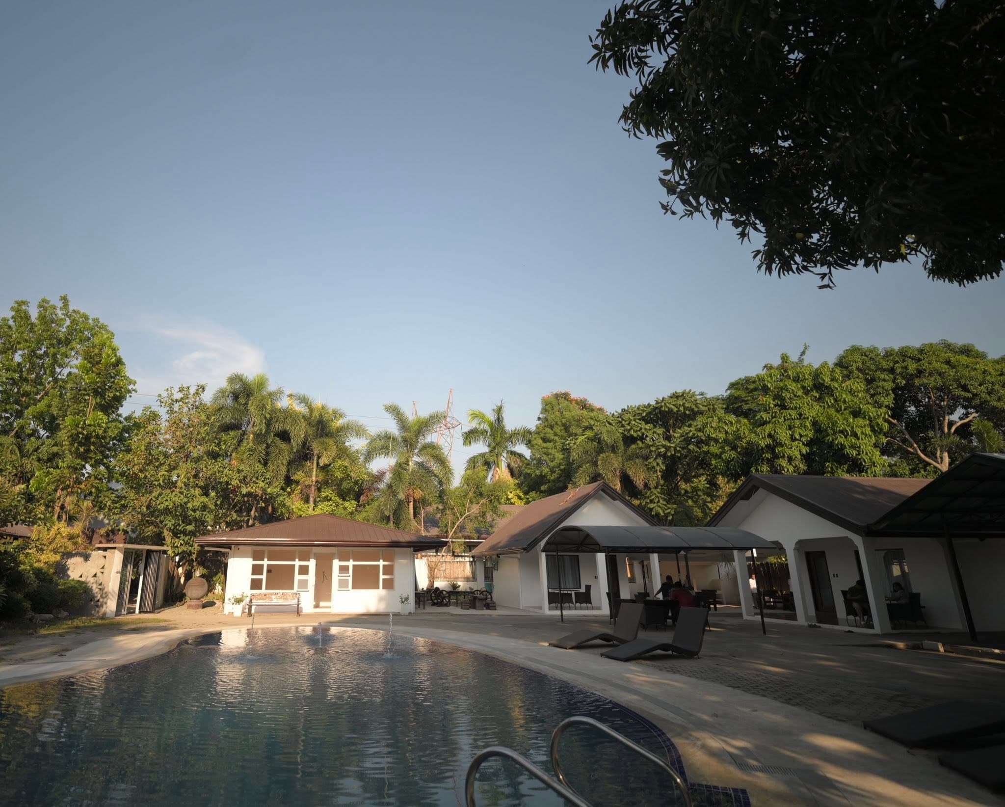 Pool area with tropical gardens
